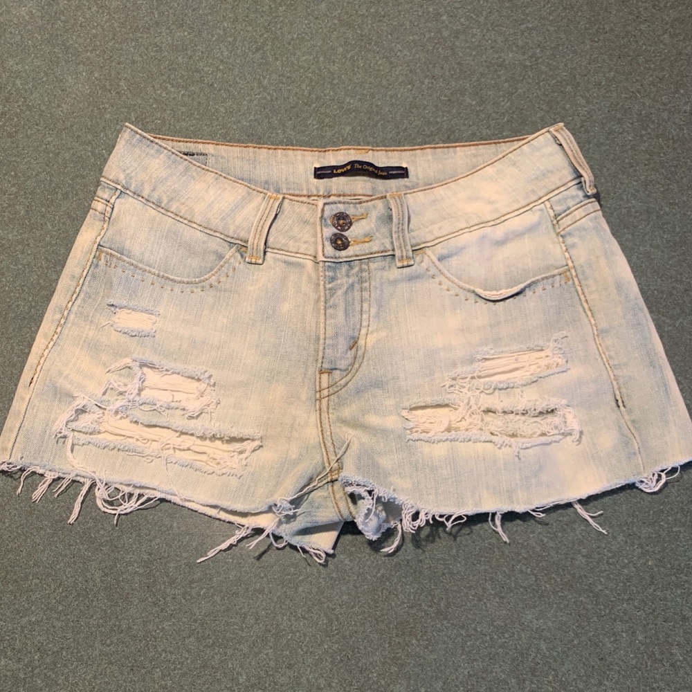 Vintage Levi’s light wash hand ripped jean shorts